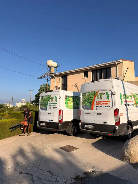 Vans parked at a hillside job
