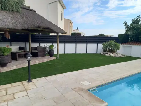 Artificial lawn and a poolside gazebo