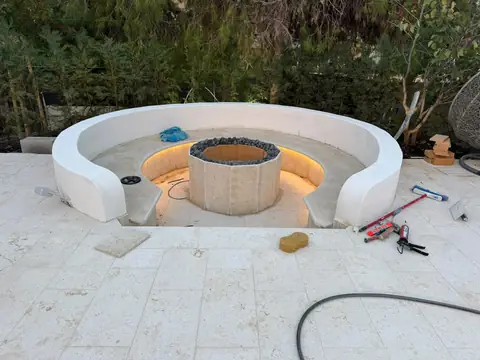 A sunken fire-pit seating area we built