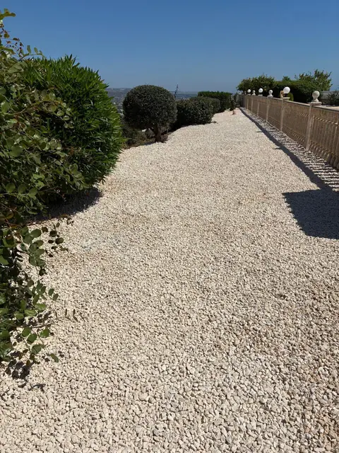 A gravel path laid along the terrace
